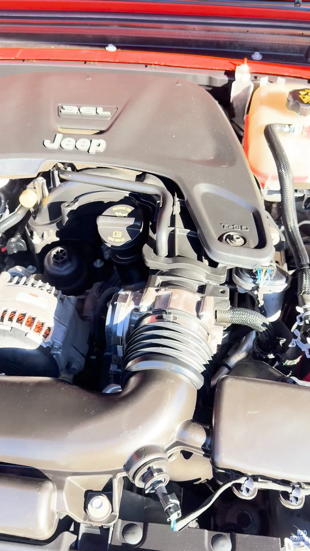 Engine bay of 2018 Jeep Wrangler Unlimited All New Sahara Sport Utility 4D
