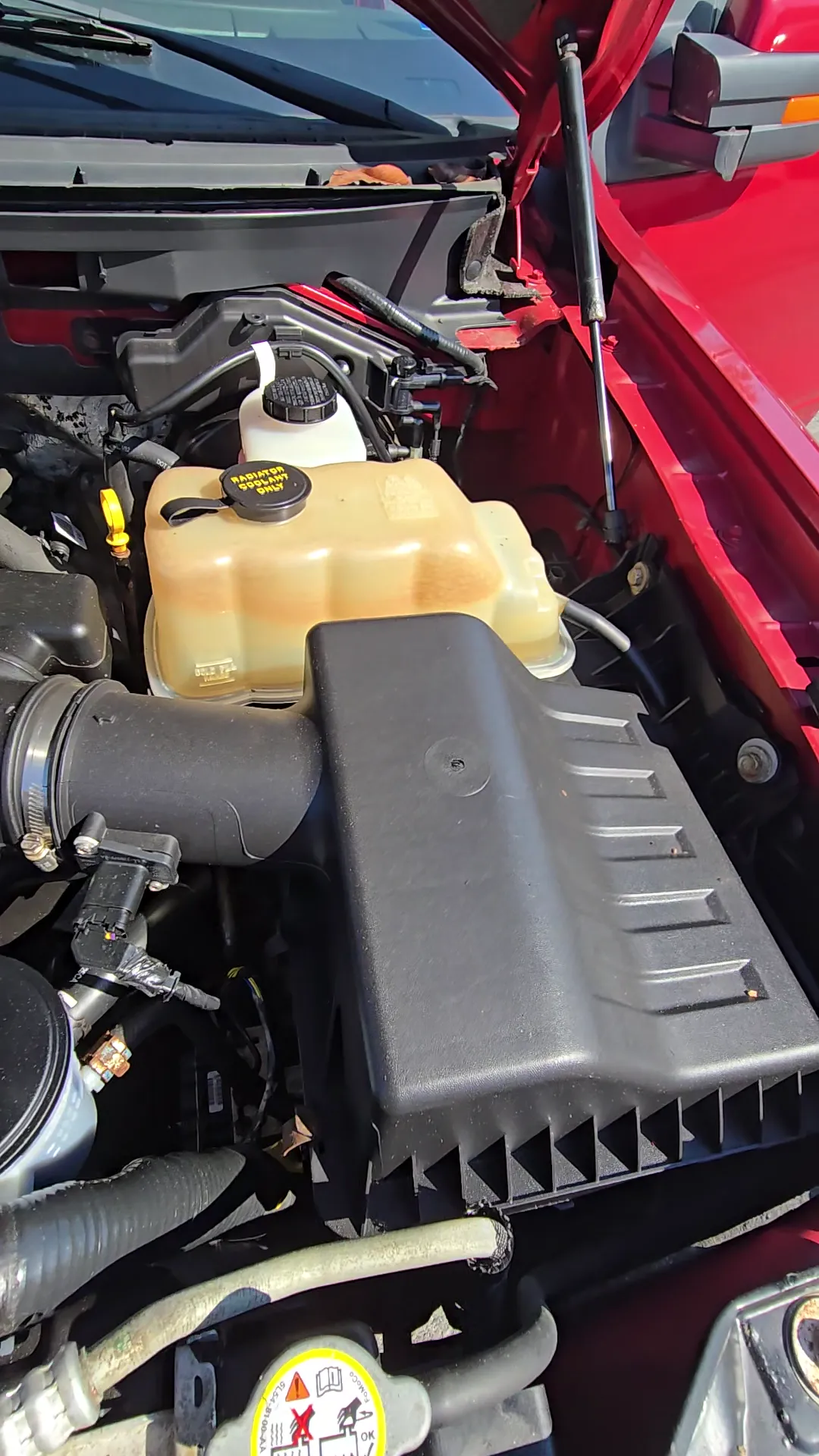 Engine bay of 2010 Ford F150 SuperCrew Cab Lariat Pickup 4D 6 1/2 ft