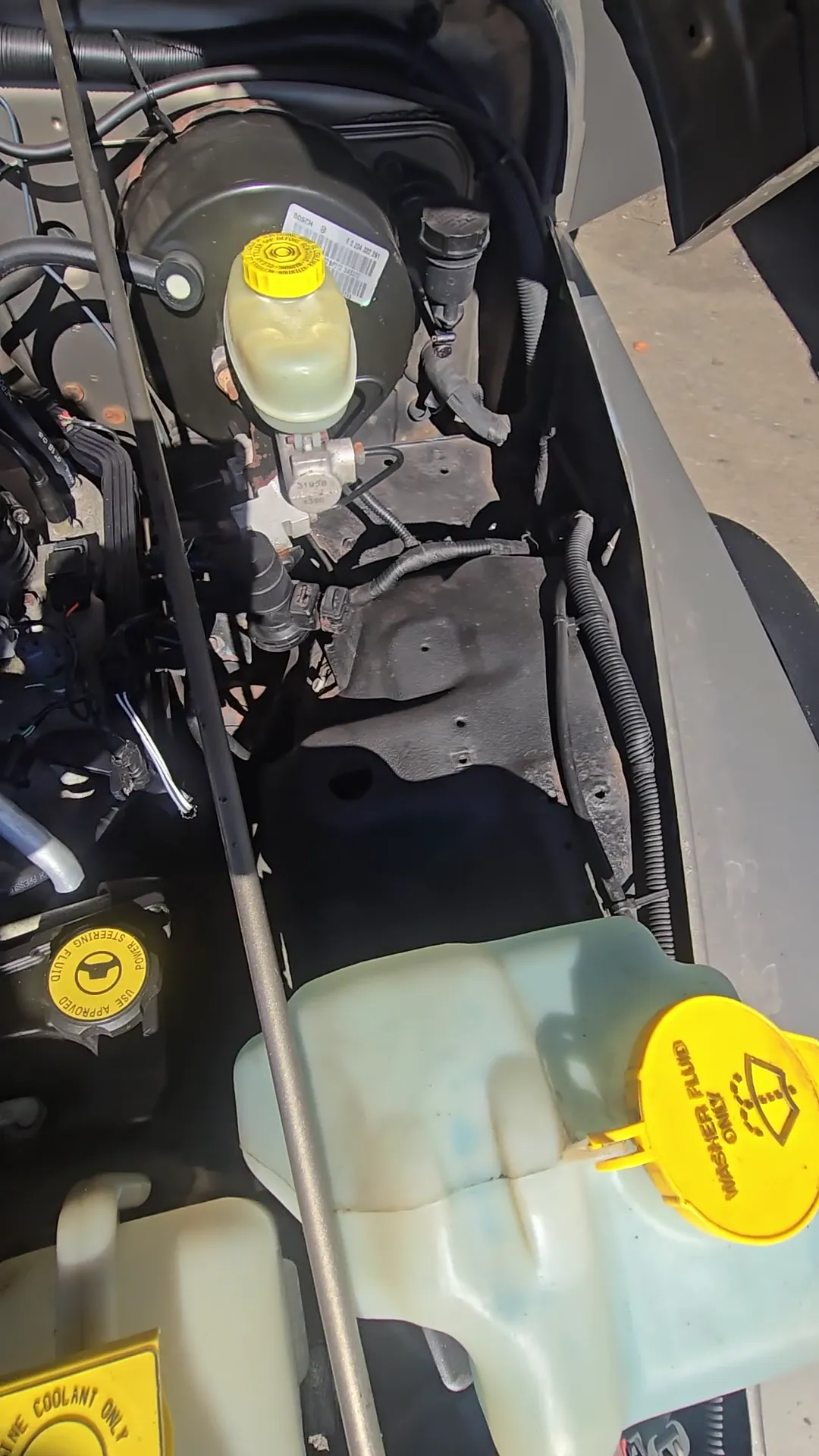 Engine bay of 2004 Jeep Wrangler X Sport Utility 2D