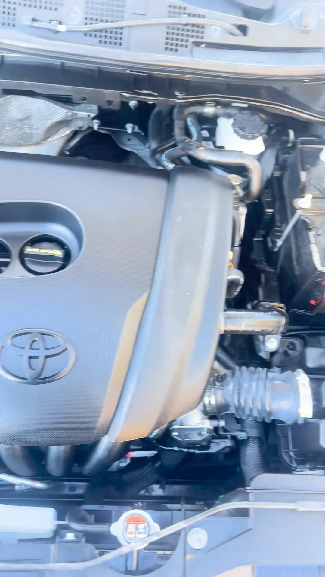 Engine bay of 2020 Toyota Yaris Hatchback XLE Sedan 4D
